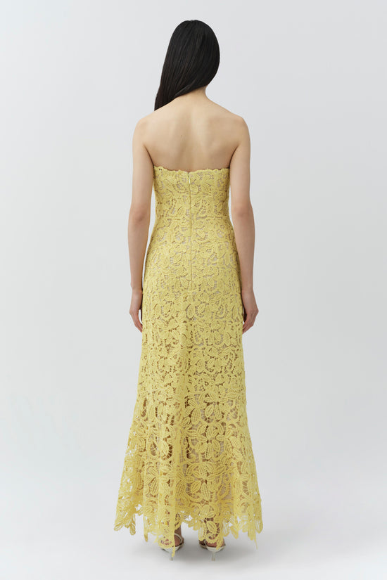 Yellow strapless lace midi dress with floral pattern and asymmetrical hem, shown from back view.