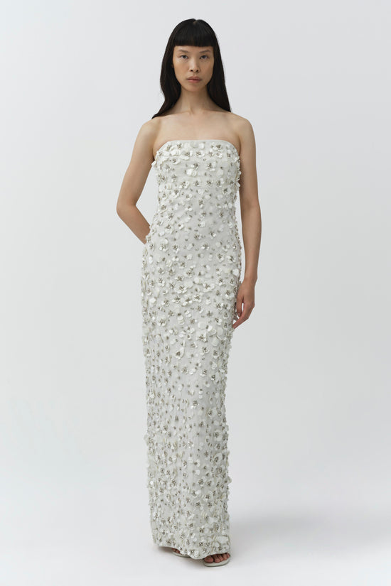 White strapless floor-length gown with silver beaded embellishments throughout.