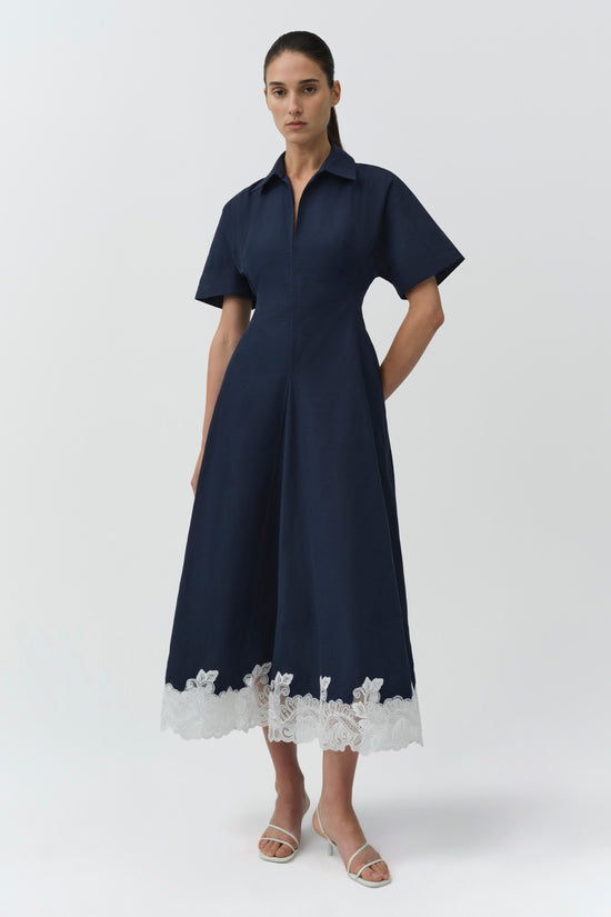 Navy cotton faille midi dress with short sleeves, button front, and white lace trim at hemline.
