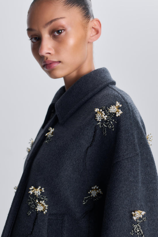 Charcoal wool jacket with gold and crystal floral embellishments scattered across the front and shoulders.