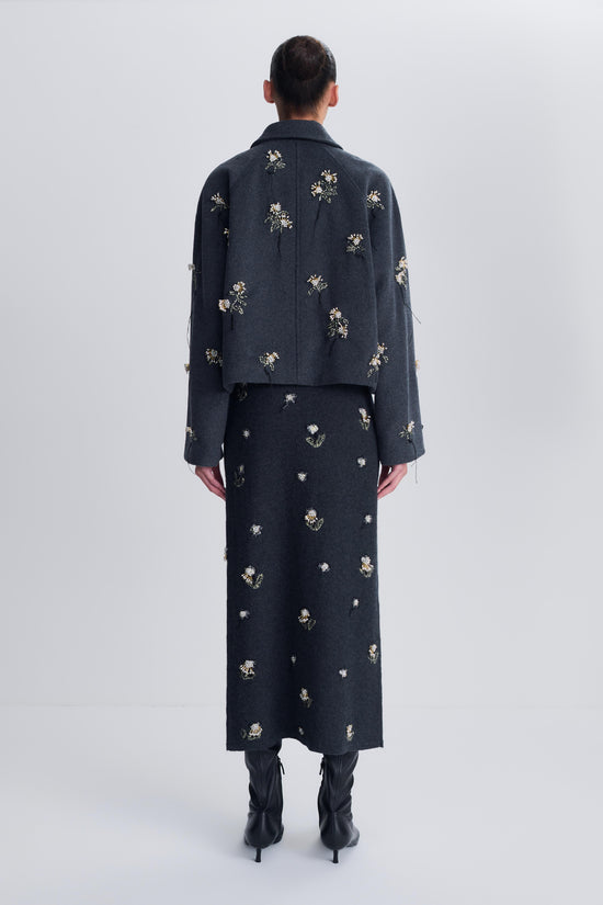 Charcoal wool jacket with scattered gold and silver floral embellishments, cropped length, shown from back.