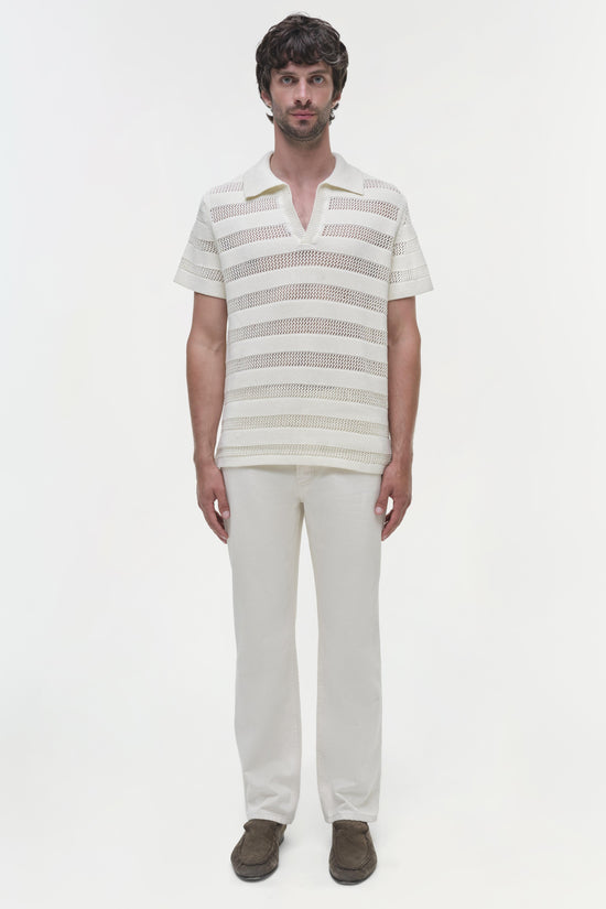 Men's cream polo with horizontal mesh stripes and collar, paired with cream pants.