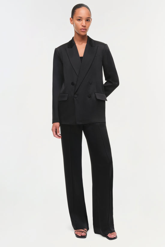 Person wearing a black suit front view