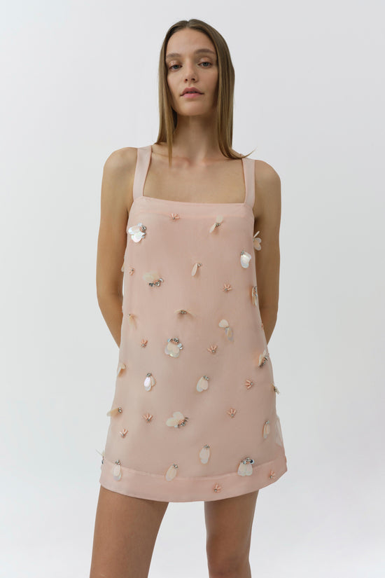 Blush pink sleeveless mini dress with square neckline and scattered crystal and pearl embellishments throughout.