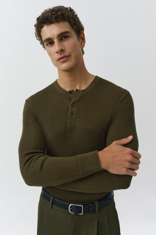 Olive green ribbed henley with button placket and long sleeves on model.