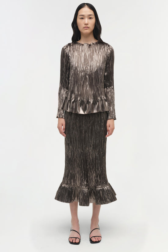 Silver metallic pleated long-sleeve top with crew neckline and gathered hem on model.