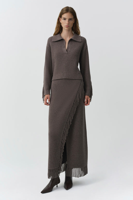 Gray ribbed sweater with collared neckline and matching maxi skirt with fringe trim.