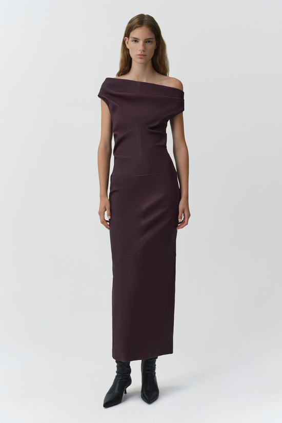 Burgundy leather midi dress with off-shoulder neckline and short sleeves on model wearing black boots.