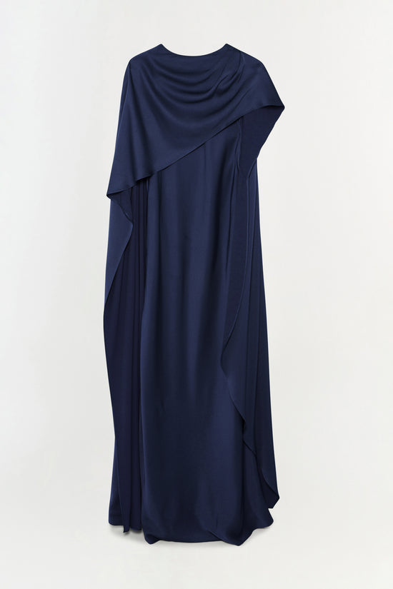 Navy satin gown with draped cape overlay and floor-length silhouette.
