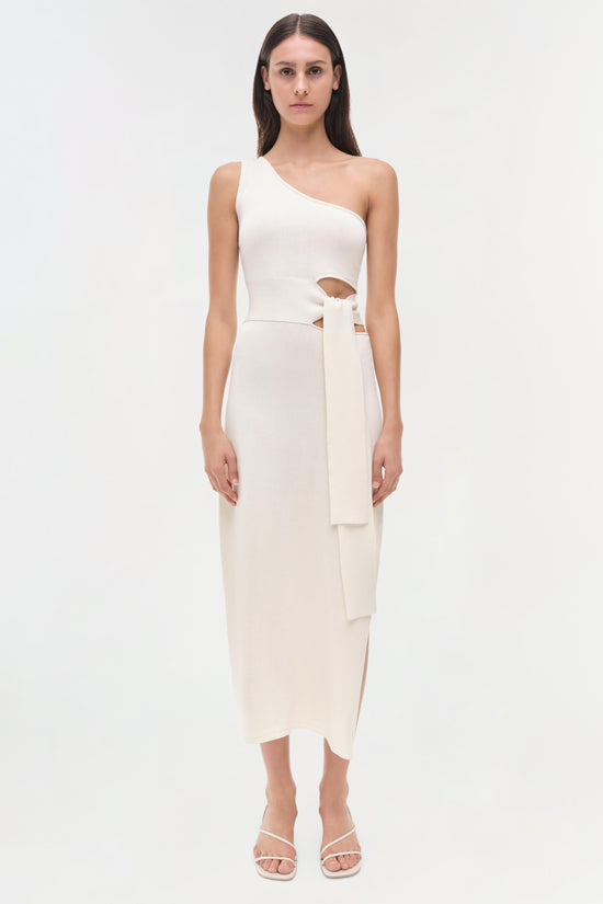 White one-shoulder midi dress with cutout detail at waist and tied fabric accent.