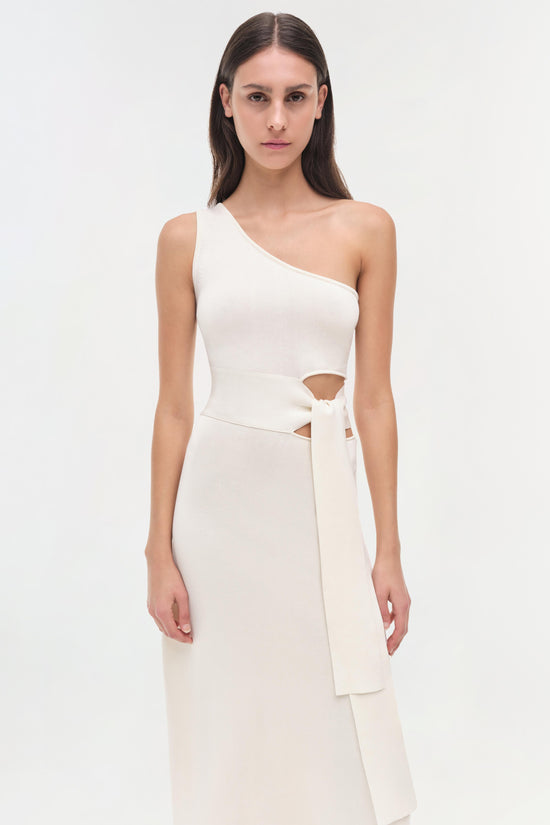 White one-shoulder dress with cutout waist detail and tied wrap belt.