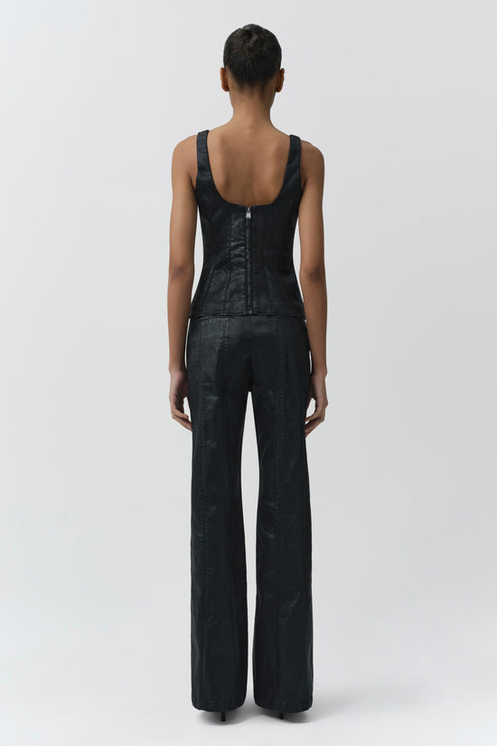 Black coated denim trousers with wide legs worn with matching sleeveless tank top, shown from back.