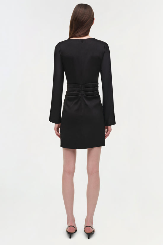 Black satin mini dress with long bell sleeves and ruched waist detail, shown on model from back view.