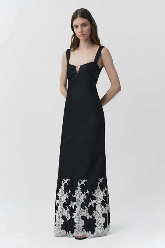 Black sleeveless gown with square neckline and white lace trim at hemline.