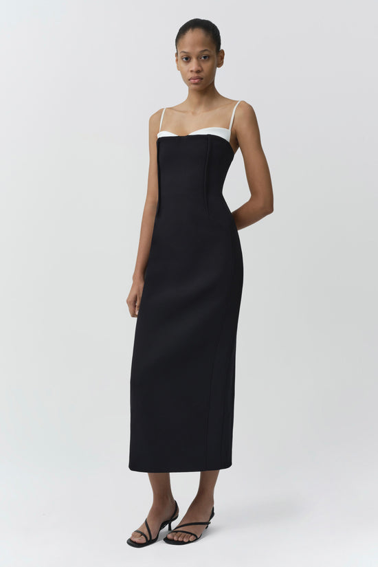 Black midi dress with white color-block neckline and thin shoulder straps.
