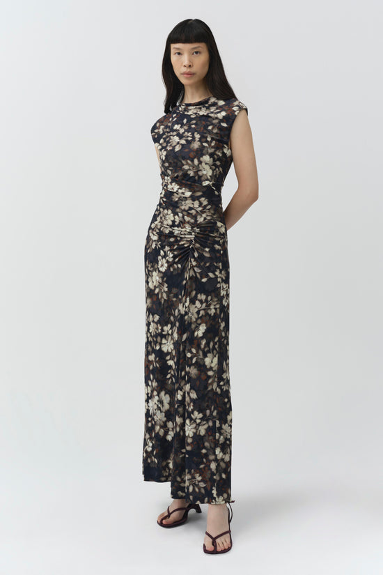Black midi dress with cream and brown floral print, sleeveless design, and draped ruching at waist.