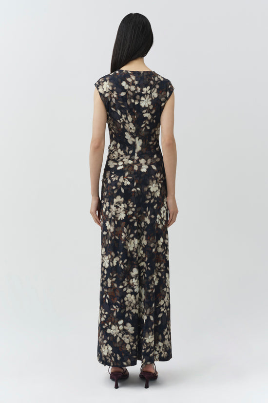 Black midi dress with cream floral print, cap sleeves, and draped fabric detail at center front.