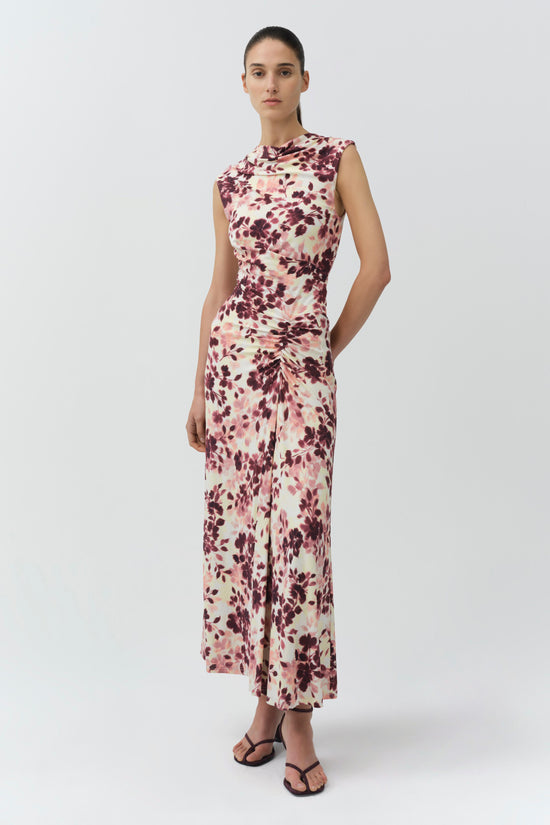Sleeveless midi dress with burgundy and pink floral print on cream background, featuring draped ruching at sides.