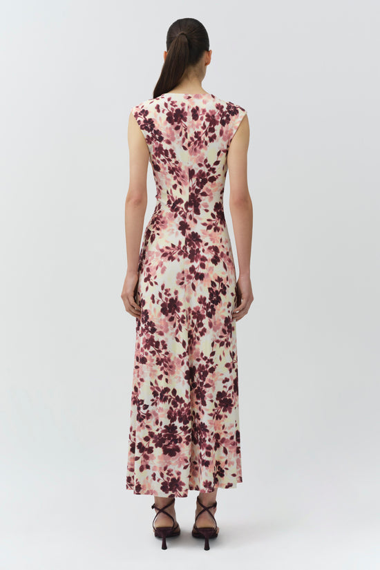 Sleeveless midi dress with burgundy and pink floral print on cream background, fitted bodice with draped skirt.