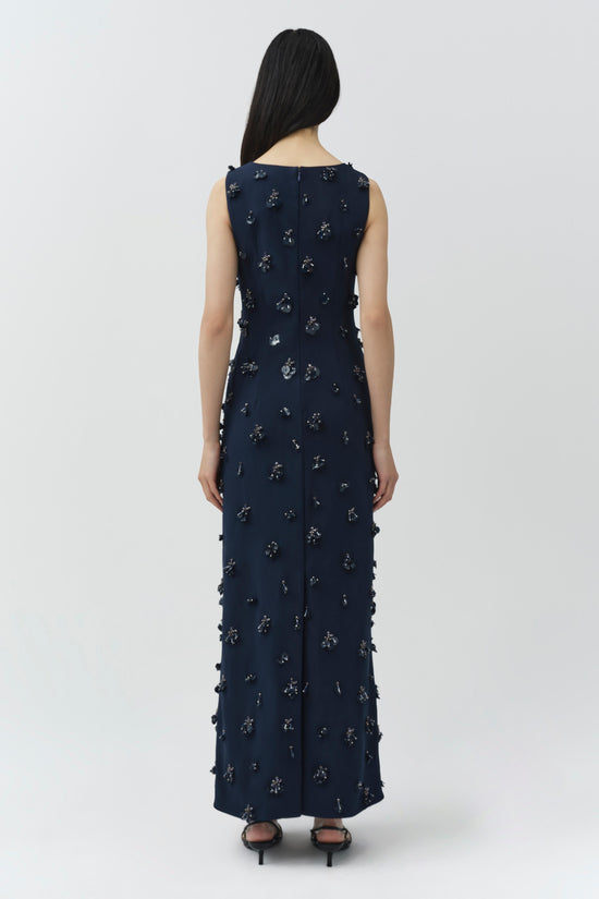 Navy sleeveless midi dress with scattered beaded embellishments throughout, shown from back view on model.