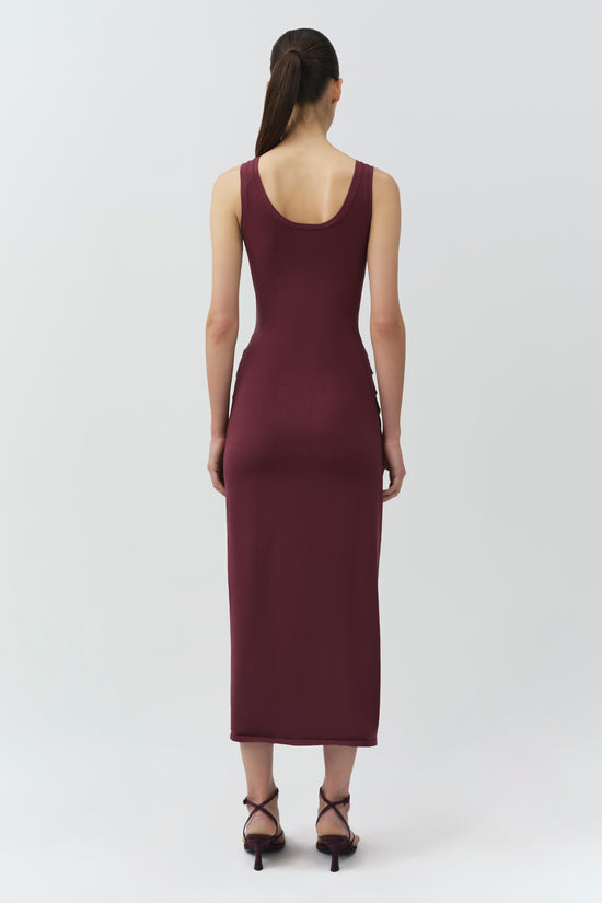 Burgundy sleeveless knit midi dress with scoop neckline, shown on model from back view.
