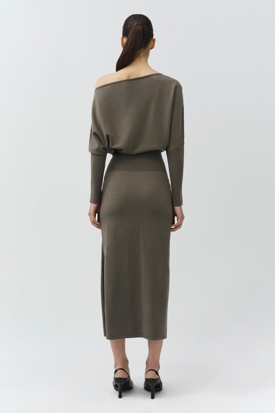 Olive green off-shoulder knit midi dress with long sleeves, shown from back on model wearing black heels.