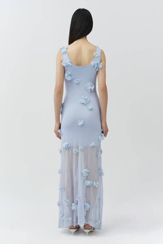 Light blue midi dress with three-dimensional floral appliqués throughout, ruffle straps, and sheer mesh skirt hem.