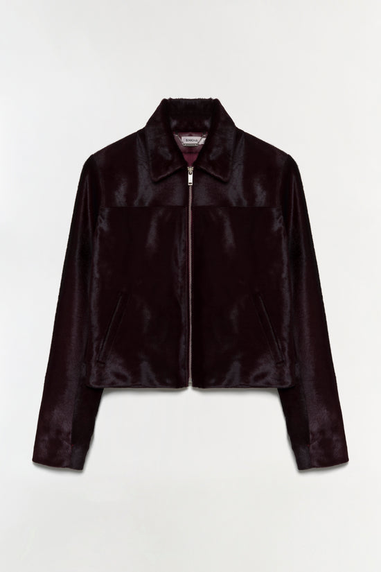 Black calf hair jacket with collar, front zip closure, and side pockets.