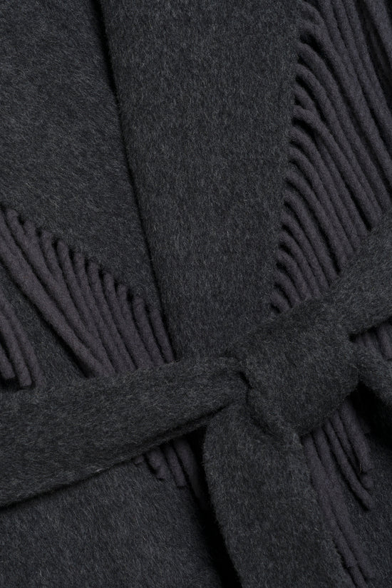 Charcoal wool coat with fringe trim along edges and hem.