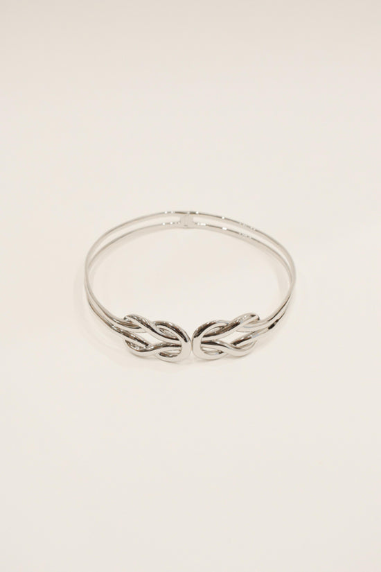 Silver-toned choker with braided twisted detail at center front.