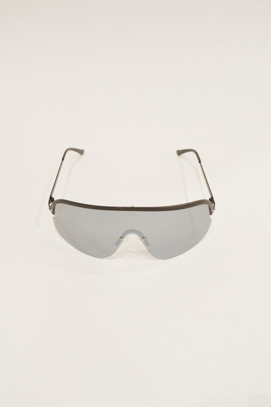 Oversized shield sunglasses with silver-toned lenses and dark metal frame and arms.