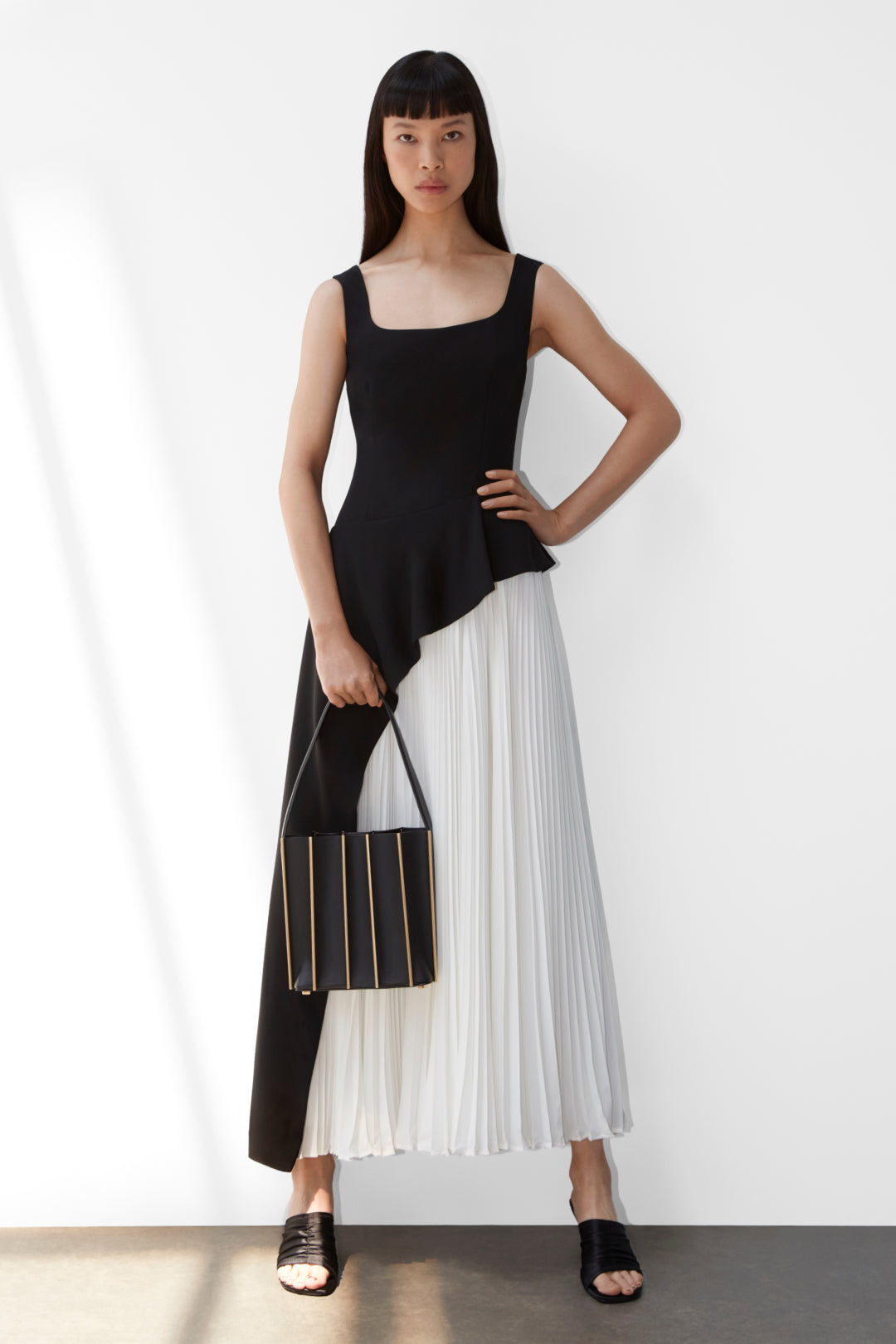 black dress with white pleated skirt Black&White dress with a pleated skirt, Parisienne