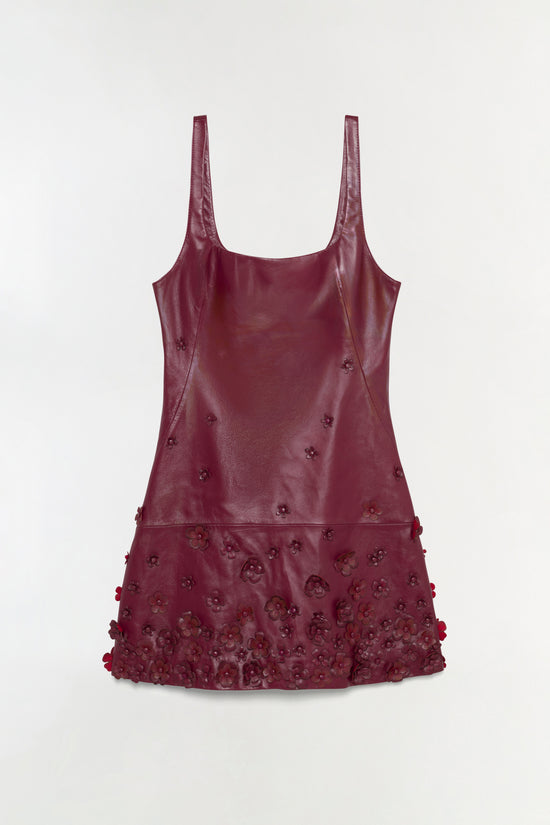Burgundy leather mini dress with floral embellishments concentrated on the lower half and scattered across the bodice.