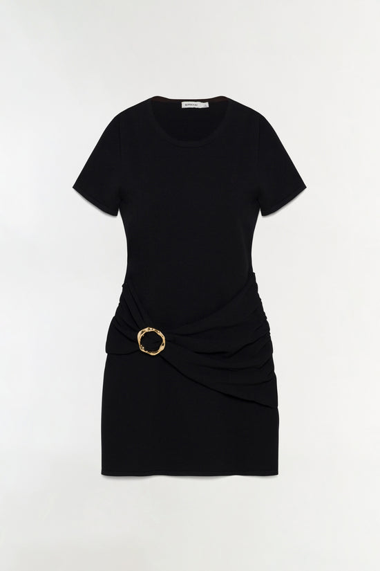 Black knit mini dress with short sleeves, crew neckline, and draped side detail with gold circular buckle.