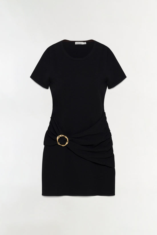 Black knit mini dress with short sleeves, crew neckline, and draped side detail with gold circular buckle.