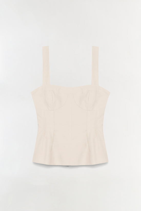 Cream cotton bustier top with structured bodice and thin shoulder straps.