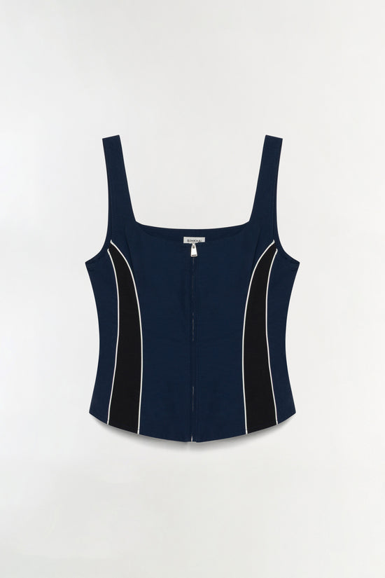 Navy bustier top with black and white side panels and front zip closure.