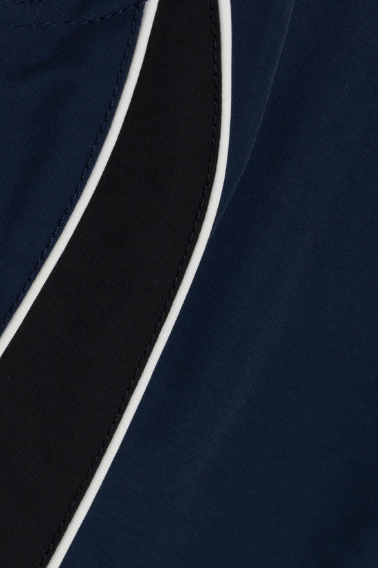 Navy and black bustier top with white trim piping detail and contrasting interior lining.