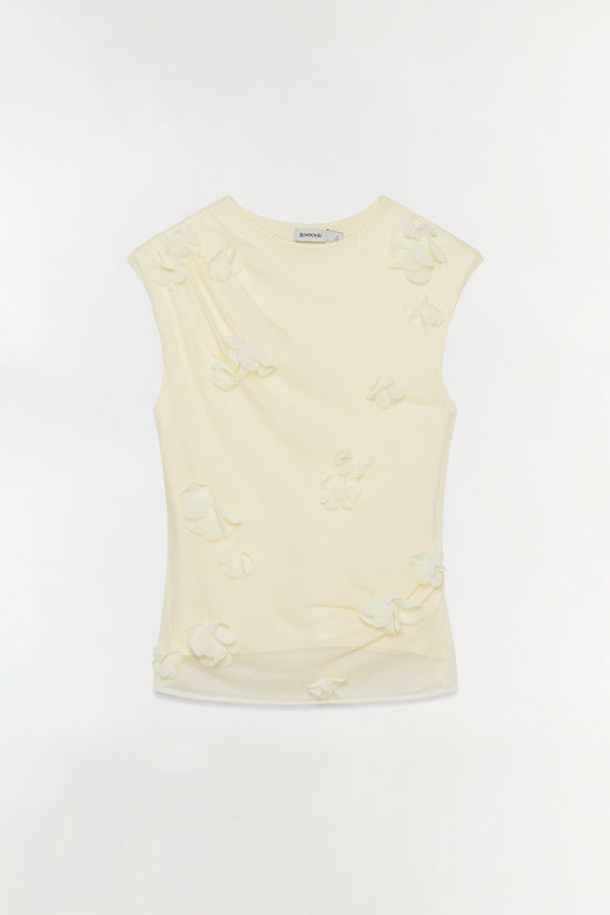 Cream sleeveless top with cream-colored floral appliqués scattered across the front and back.