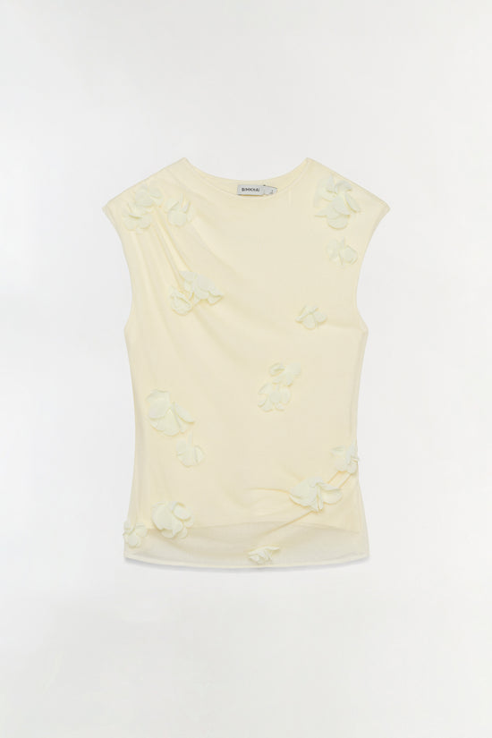 Cream sleeveless top with cream-colored floral appliqués scattered across the front and back.