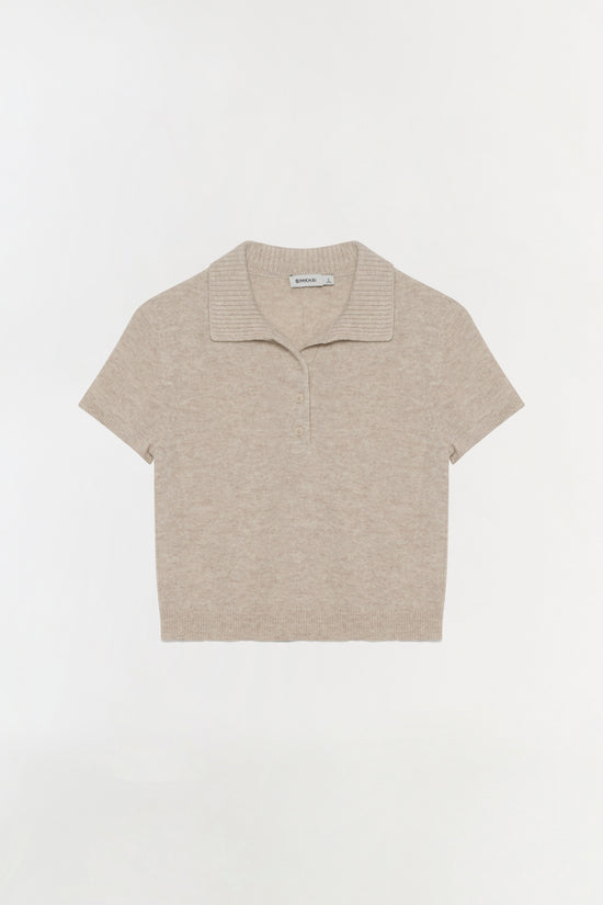 Beige short-sleeve polo with ribbed collar and button front closure.