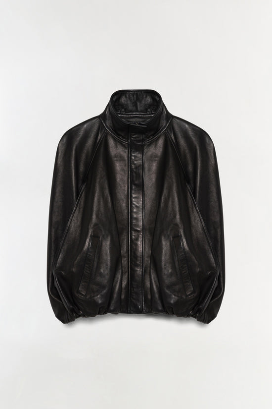 Black leather cape jacket with high neckline, full sleeves, front zip closure, and flap pockets.