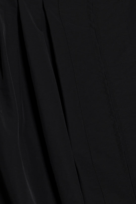 Black cotton faille jacket with vertical pleated details and structured panels.