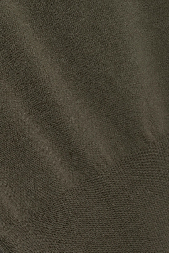 Olive green knit sweater with ribbed texture detail along the bottom edge.