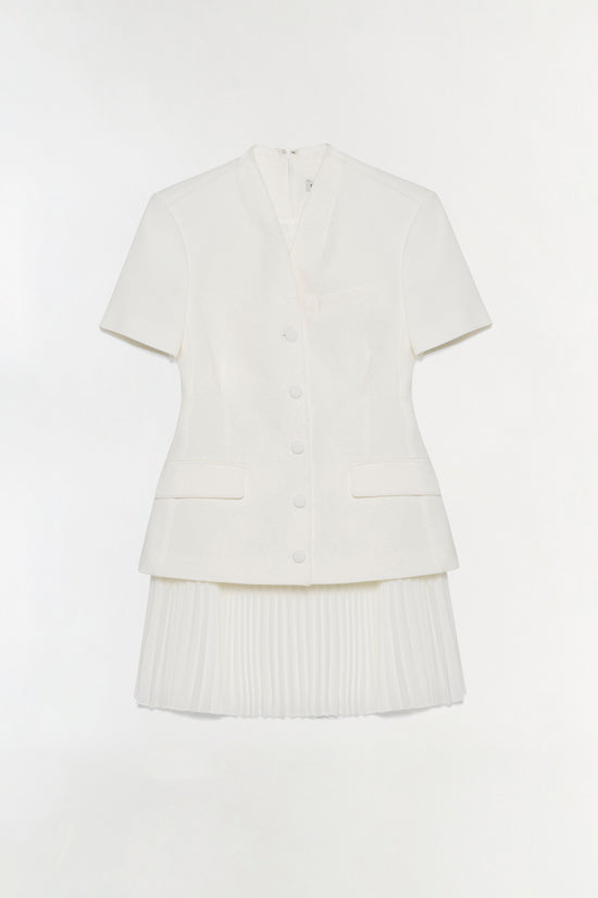 White short-sleeve blazer mini dress with button front, chest pockets, and pleated skirt detail.