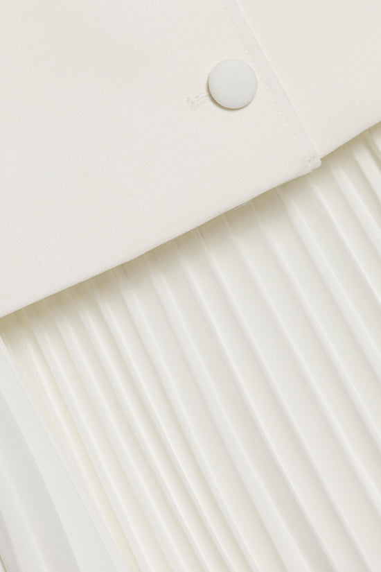 Cream-colored blazer mini dress with single button closure and pleated skirt detail.