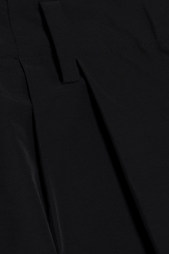 Black wide-leg pant with pleated front detail and draped fabric folds.