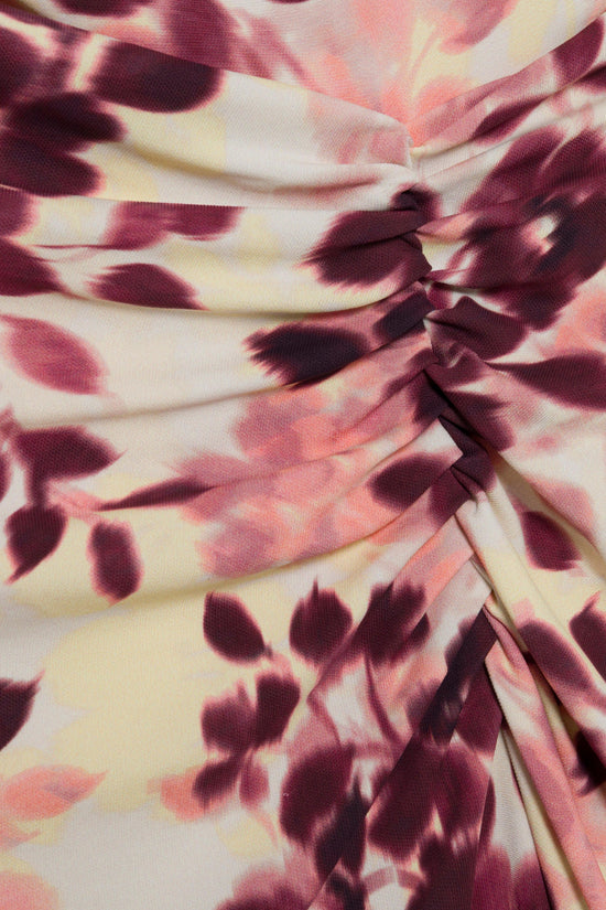 Draped burgundy and pink floral print jersey fabric with gathered ruching detail on cream background.