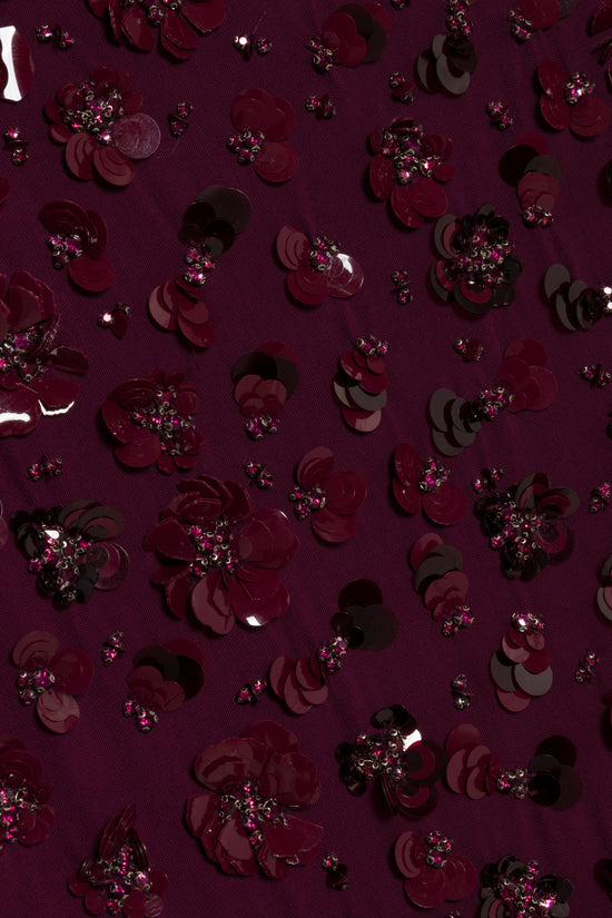 Burgundy fabric with layered petal appliqués and rhinestone clusters scattered throughout.