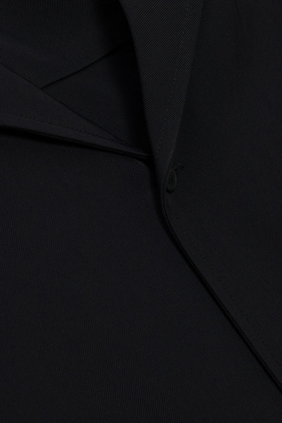 Black camp shirt with ribbed texture and button-up front closure detail.